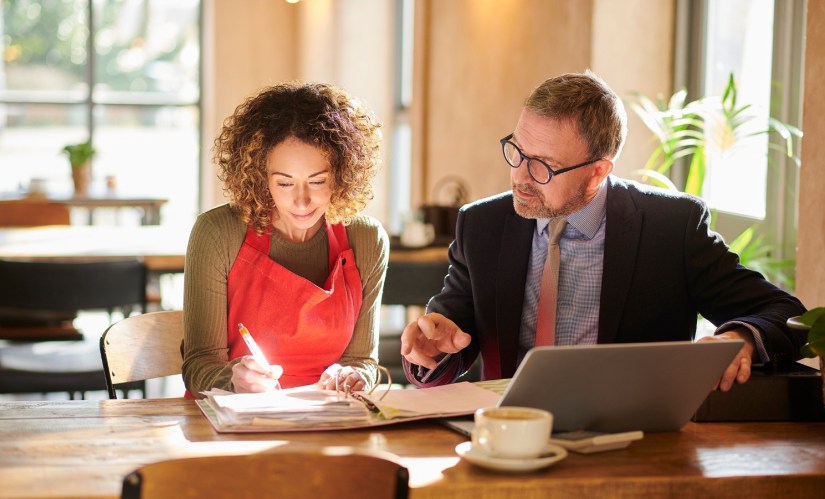 Small business woman and man looking at a computer