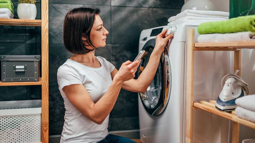 service remote virtual assistance, woman next to dryer