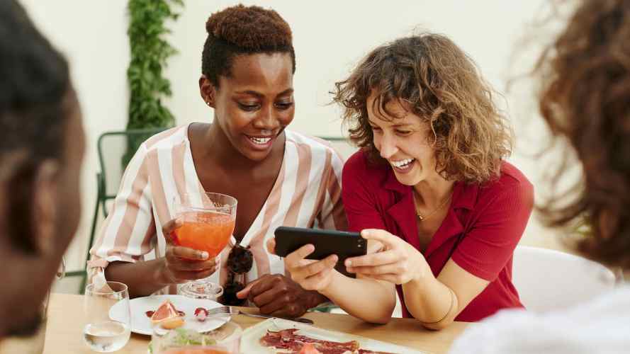 Friends chat over drinks and snacks