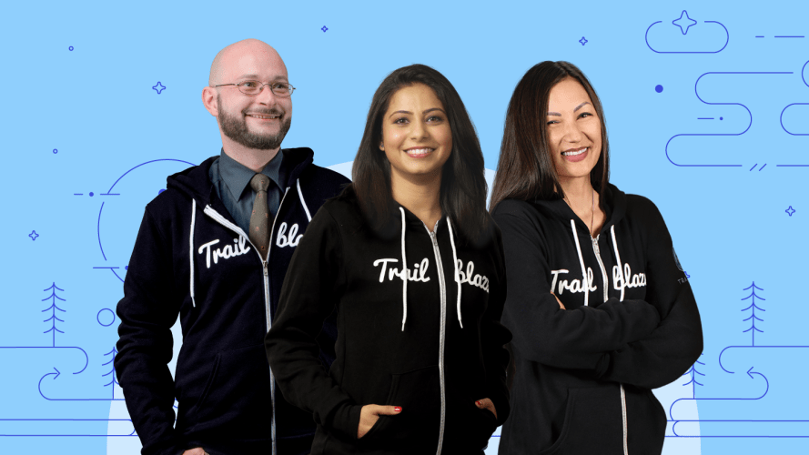 A group of three Developer Trailblazers stand together in their black Trailblazer hoodies against a blue background with line art details.