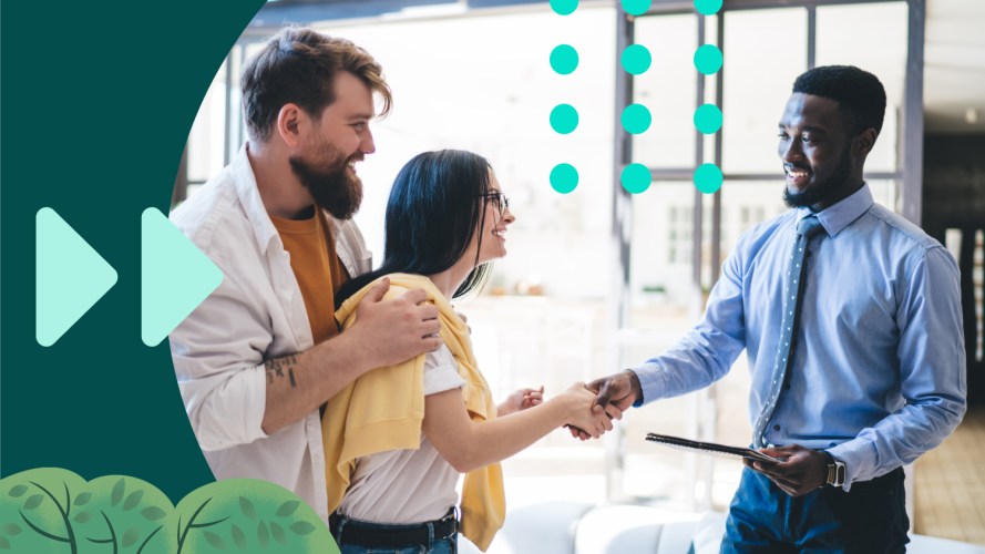 Photo of a man shaking hands with a woman after making an inbound sale.