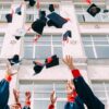 graduates throwing hats in the air