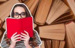 Woman-looking-over-book-reading-textbooks