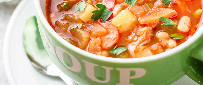 vegetable soup in green bowl