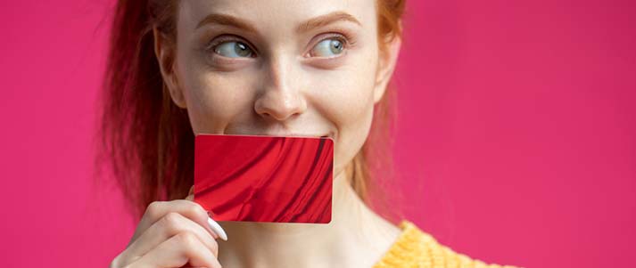 woman holding red card