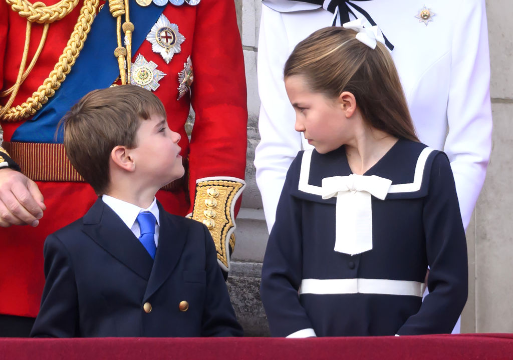 LONDON, ENGLAND - JUNE 15: Prince Louis of Wales and Princess Charlotte of Wales on the balcony of Buckingham Palace during Trooping the Colour on June 15, 2024 in London, England. Trooping the Colour is a ceremonial parade celebrating the official birthday of the British Monarch. The event features over 1,400 soldiers and officers, accompanied by 200 horses. More than 400 musicians from ten different bands and Corps of Drums march and perform in perfect harmony. (Photo by Karwai Tang/WireImage)
