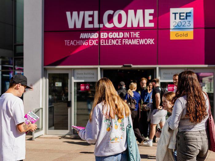 Students walking into a University building in Sheffield