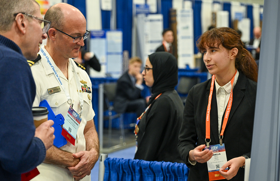 ISEF 2024 - International Science and Engineering Fair - Judging - finalists at booth with judges - Los Angeles CA