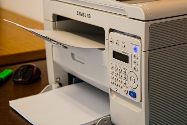 A white Samsung printer on top of a table