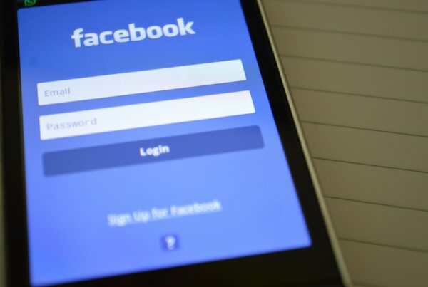 A log-in screen for Facebook is seen on a phone.