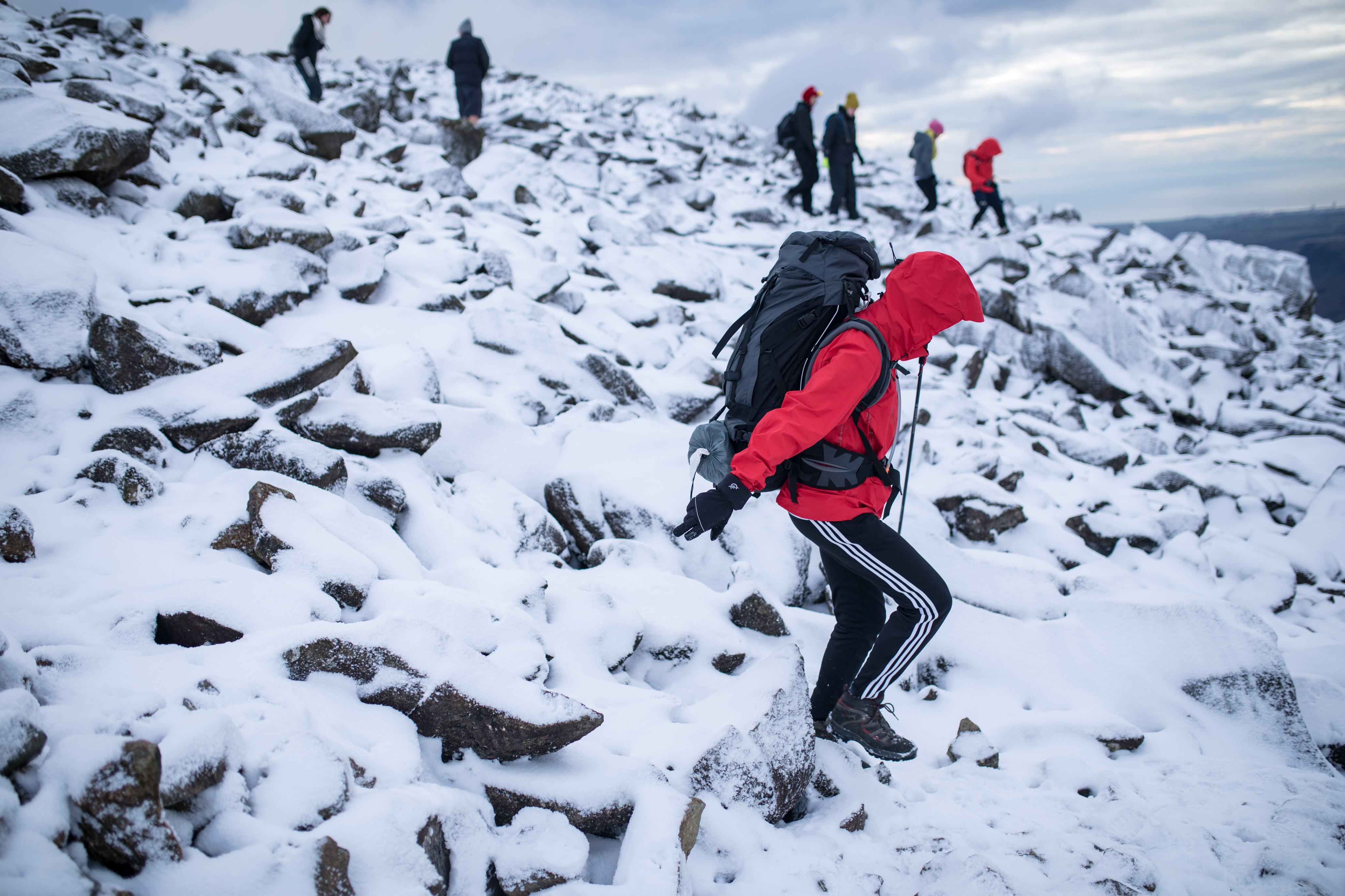 HIKERS BRAVE THE SNOW AND ICE TO CLIMB SCAFELL PIKE