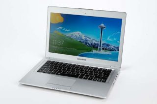 Gigabyte U2442V ultrabook with screen displaying wallpaper