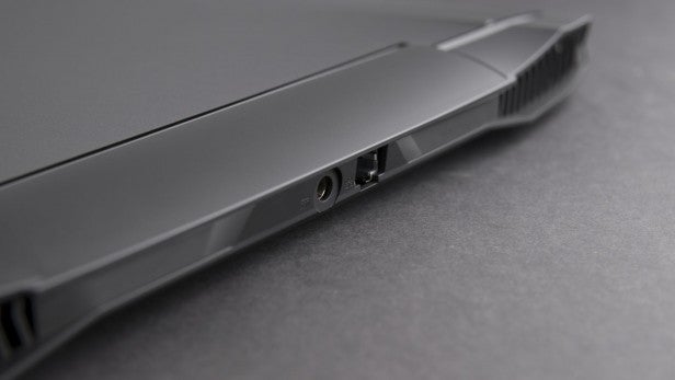 Aorus X3 Plus v5 5Close-up of laptop side with ports and battery indicator.