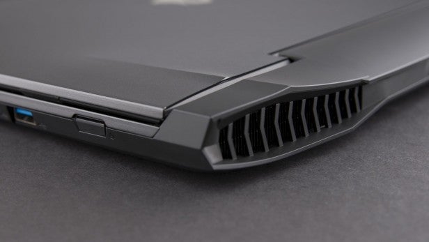 Aorus X3 Plus v5 1Close-up of laptop cooling vent and USB port.