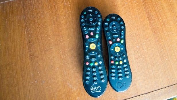 Virgin V6 2Two Virgin V6 TV remote controls side by side on a wooden surface.