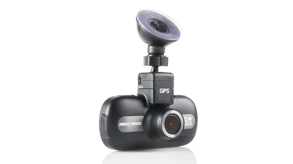 Nextbase 512GW dash cam with wide-angle lens on white background.Nextbase 512GW dash cam with GPS module on white background