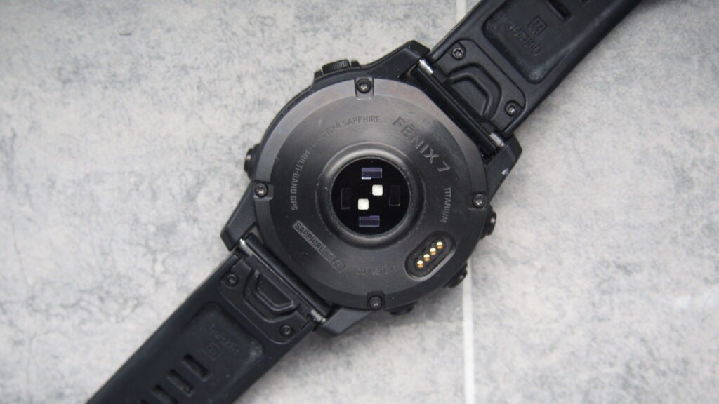 Garmin Fenix 7 reverse, showing sensorsGarmin Fenix 7 watch showing heart rate sensor and charging port