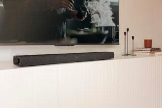 Denon DHT-S217 soundbar below TV