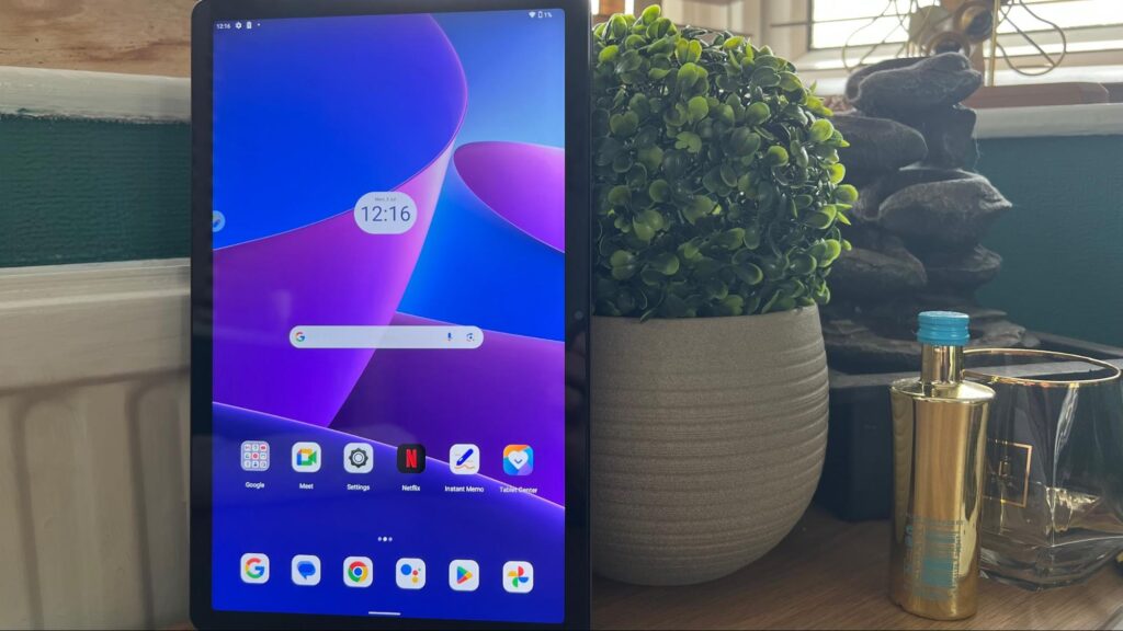 Lenovo Tab M10 Plus (3rd Gen) leaning against a flower pot