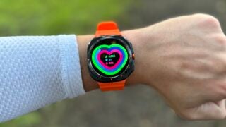 samsung-galaxy-watch-ultra on wrist with orange strap and heart on screen