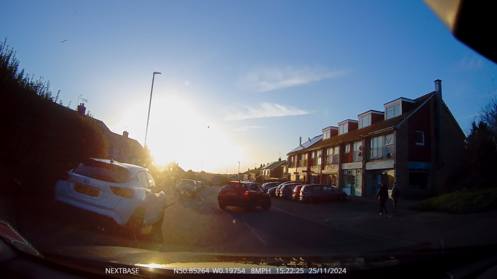 Video still showing harsh low sun on a late autumn afternoon