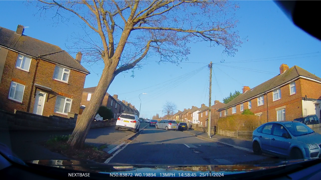 Video still frame on a bright morning with long shadows