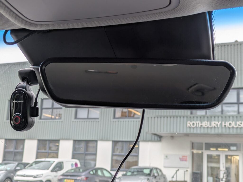 Installed camera to the side of a rear-view mirror