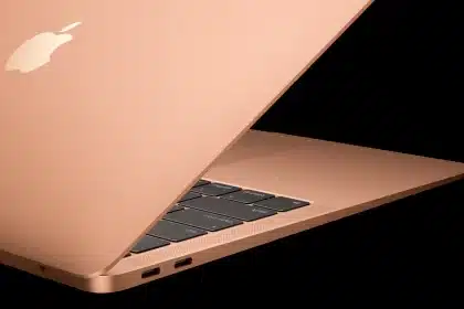 Side view of a MacBook Air in gold color.