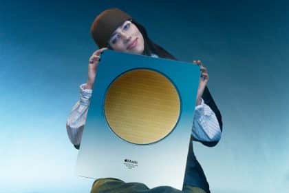 Billie Eilish holding Apple Music’s Artist of the Year 2024 award.