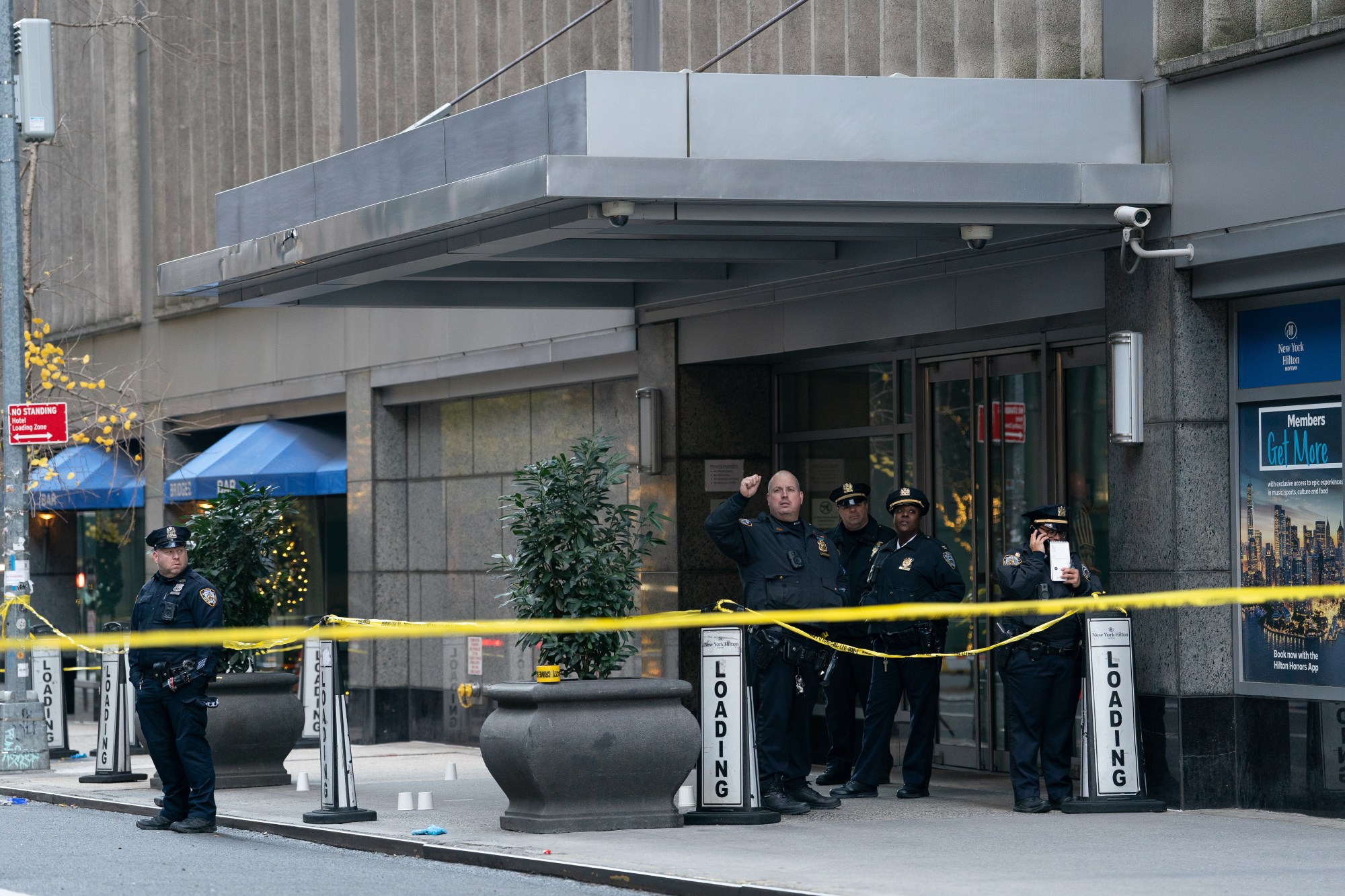 Police on the scene of deadly shooting at the Residences Hilton Club on Sixth Ave. near W. 54th St., on Wednesday, December 4, 2024. (Barry Williams / New York Daily News)