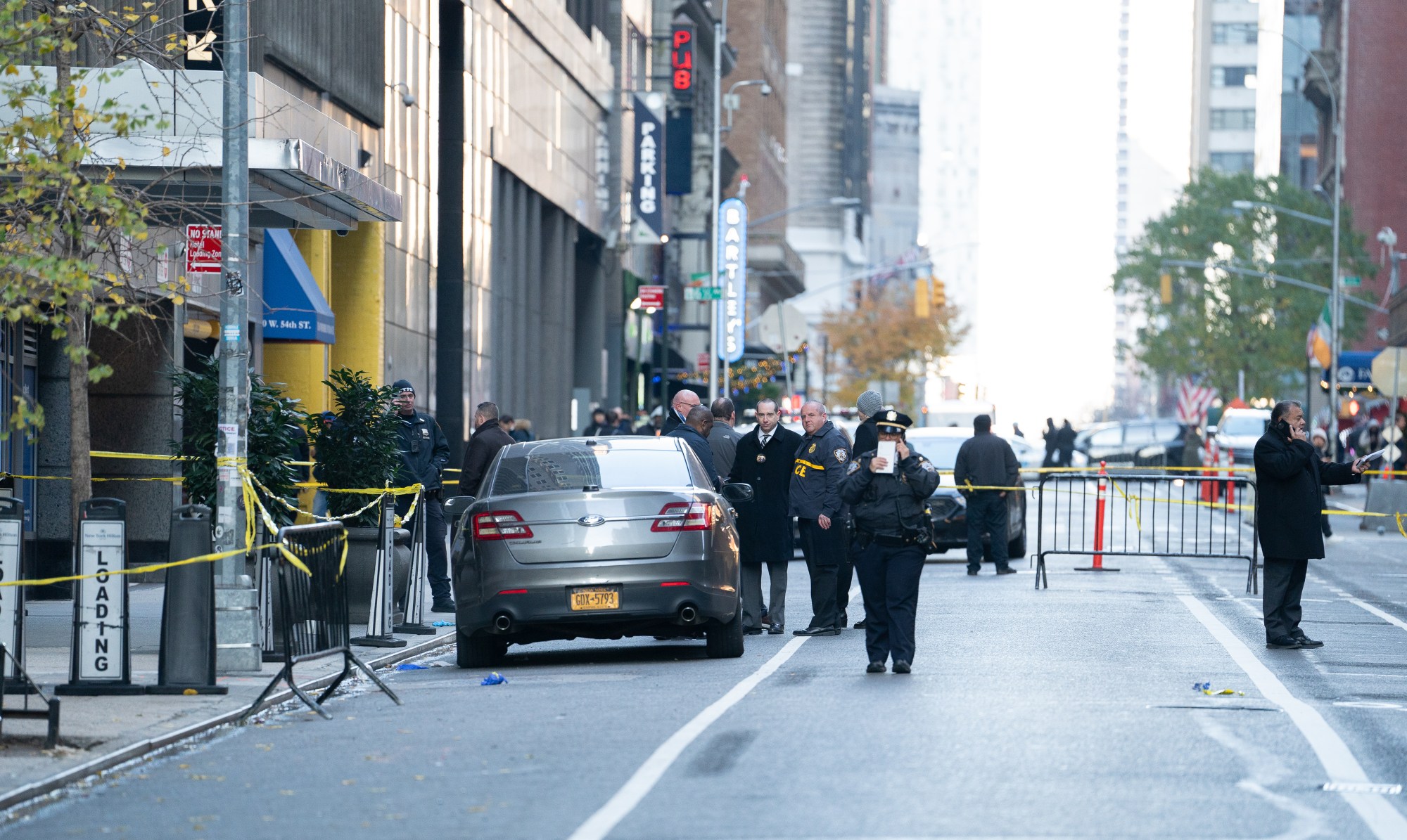 Police on the scene of deadly shooting at the Residences Hilton Club on Sixth Ave. near W. 54th St., on Wednesday, December 4, 2024. (Barry Williams / New York Daily News)