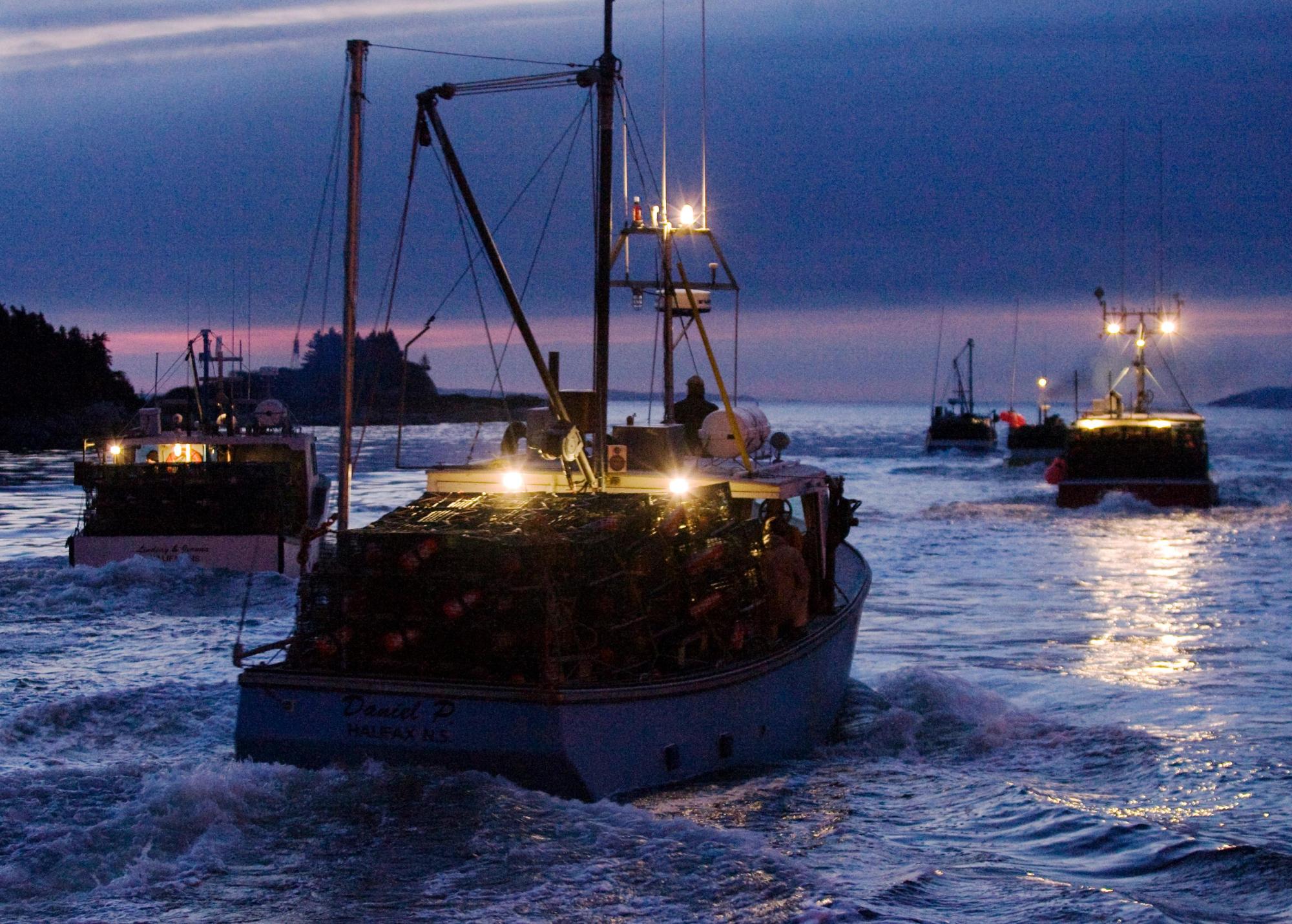 Fishing boats carrying lobster traps 