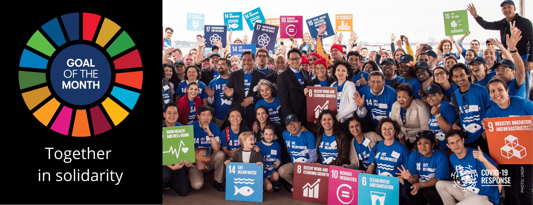 Lots of children holding SDG signs