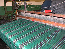 Undiscovered Scotland Tartan being woven at Andrew Elliot Ltd in  Selkirk 