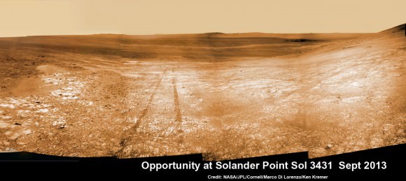 Opportunity starts scaling Solander Point - her1st mountain climbing goal. See the tilted terrain and rover tracks in this mosaic view from Solander Point peering across the vast expanse of huge Endeavour Crater.  Opportunity will ascend the mountain looking for clues indicative of a Martian habitable environment.  This navcam camera mosaic was assembled from raw images taken on Sol 3431 (Sept.18, 2013).  Credit: NASA/JPL/Cornell/Marco Di Lorenzo/Ken Kremer (kenkremer.com). See the complete panoramic view below