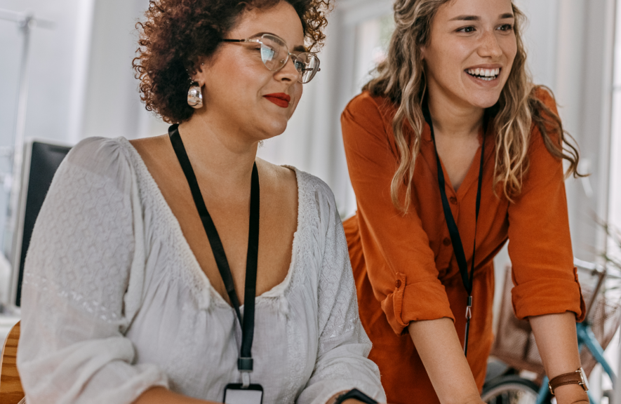 Women completing a workplace wellness assessment