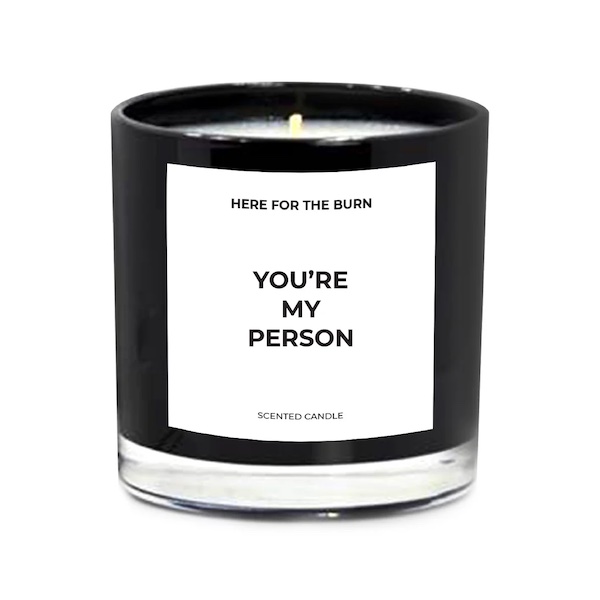 photo of a black candle that says 