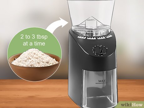 Step 1 Add 2-3 tbsp (23-35 g) of uncooked rice into the coffee grinder.