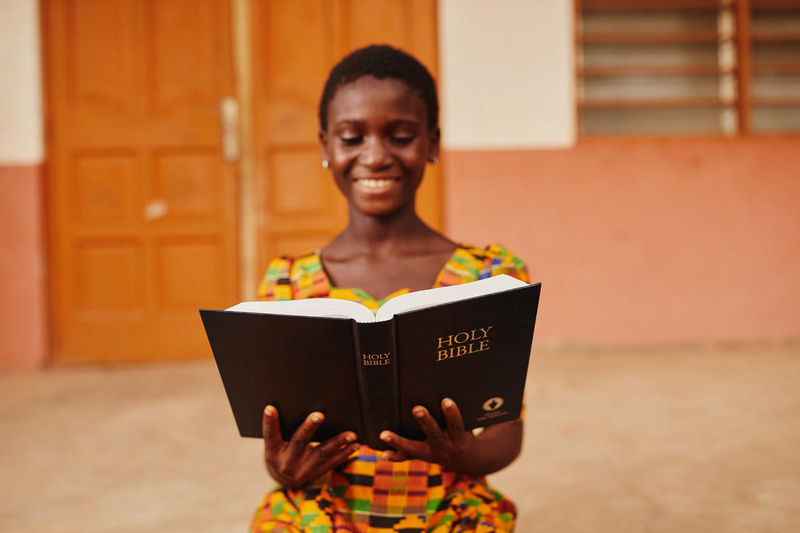 Girl in Ghana reads her Bible