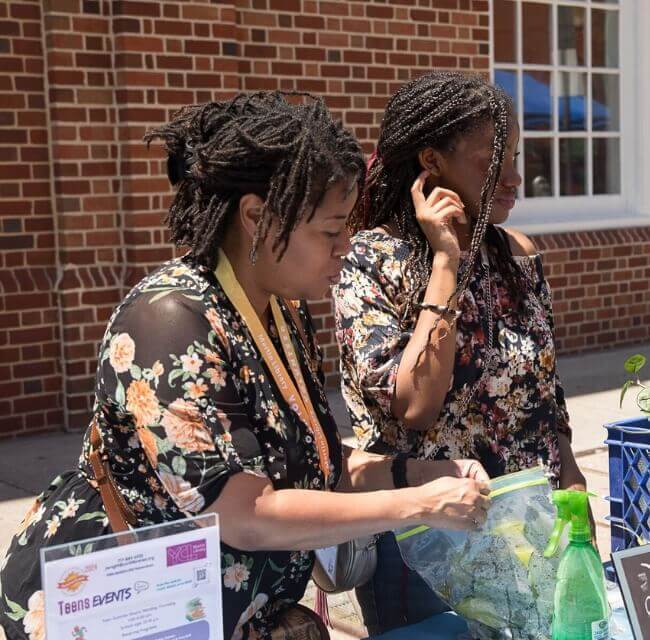 Adult Volunteers At Martin Library Block Party