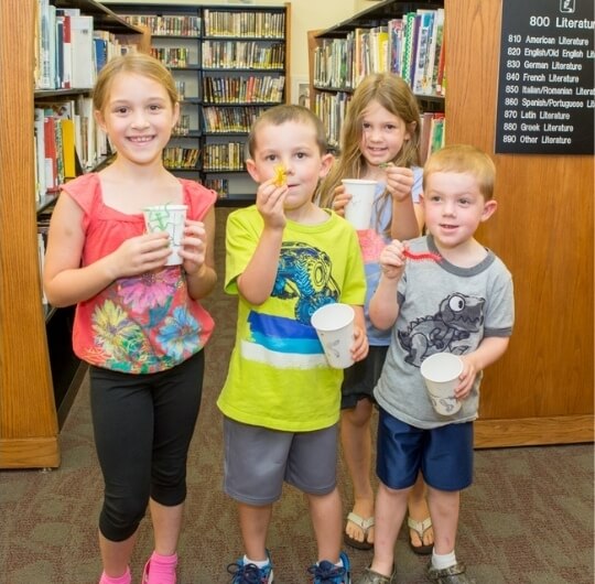 Four Children Participating In A Hands On Program At Mason Dixon Library