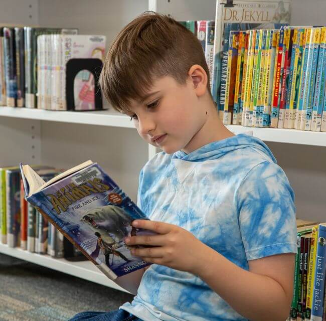 GOAL First Grader Reads A Book