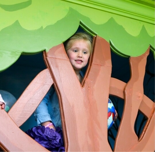 Girl Playing In Tree House At Kaltreider Benfer Library