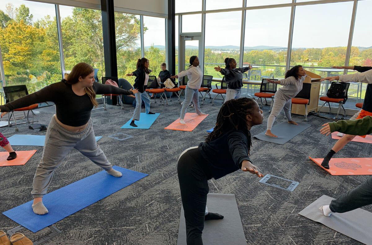 Home Page Primary Program Image Teens Do Yoga At YES