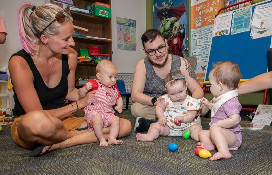 Families Meet At Story Time Babies Play