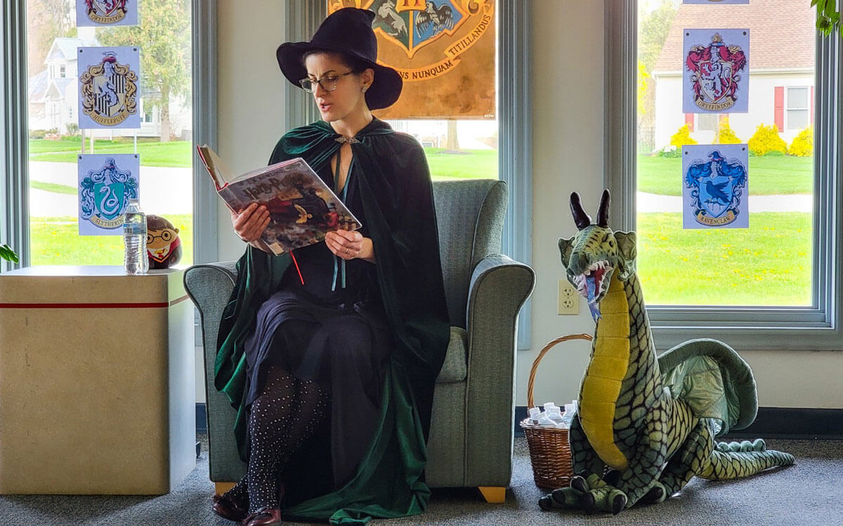 President Of Glatfelter Friends Reading Harry Potter In Cloak And Hat