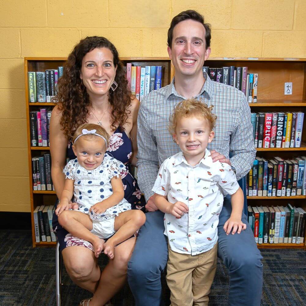 Family of Four smiling at camera